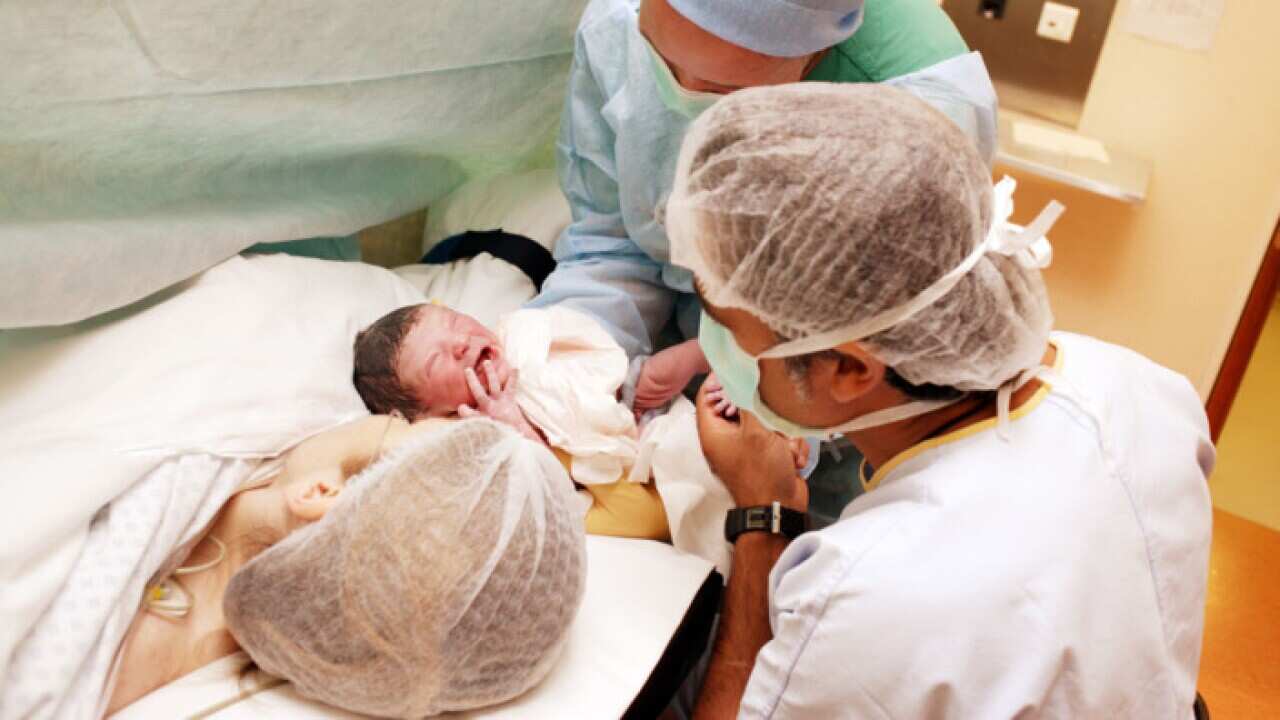 Mother with newborn baby