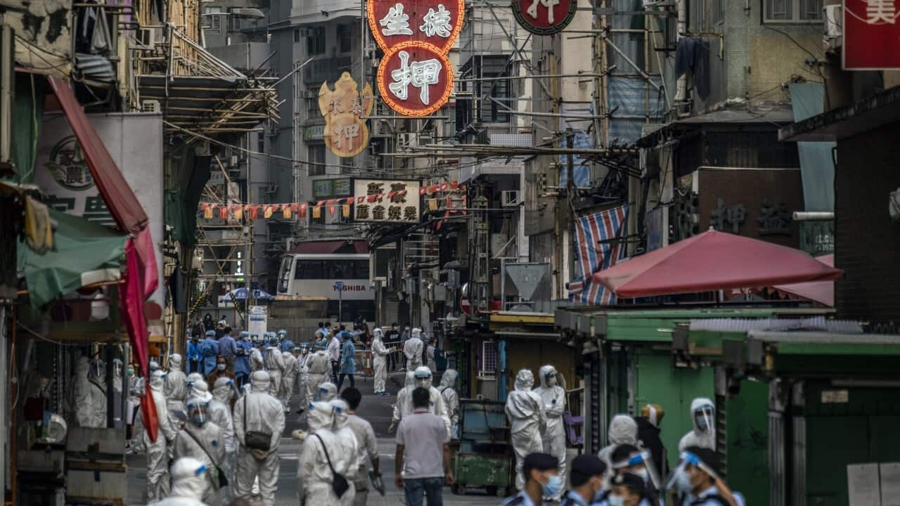 Health authorities fan out in Jordan, a working-class neighbourhood in Hong Kong, on Saturday, Jan. 23, 2021.