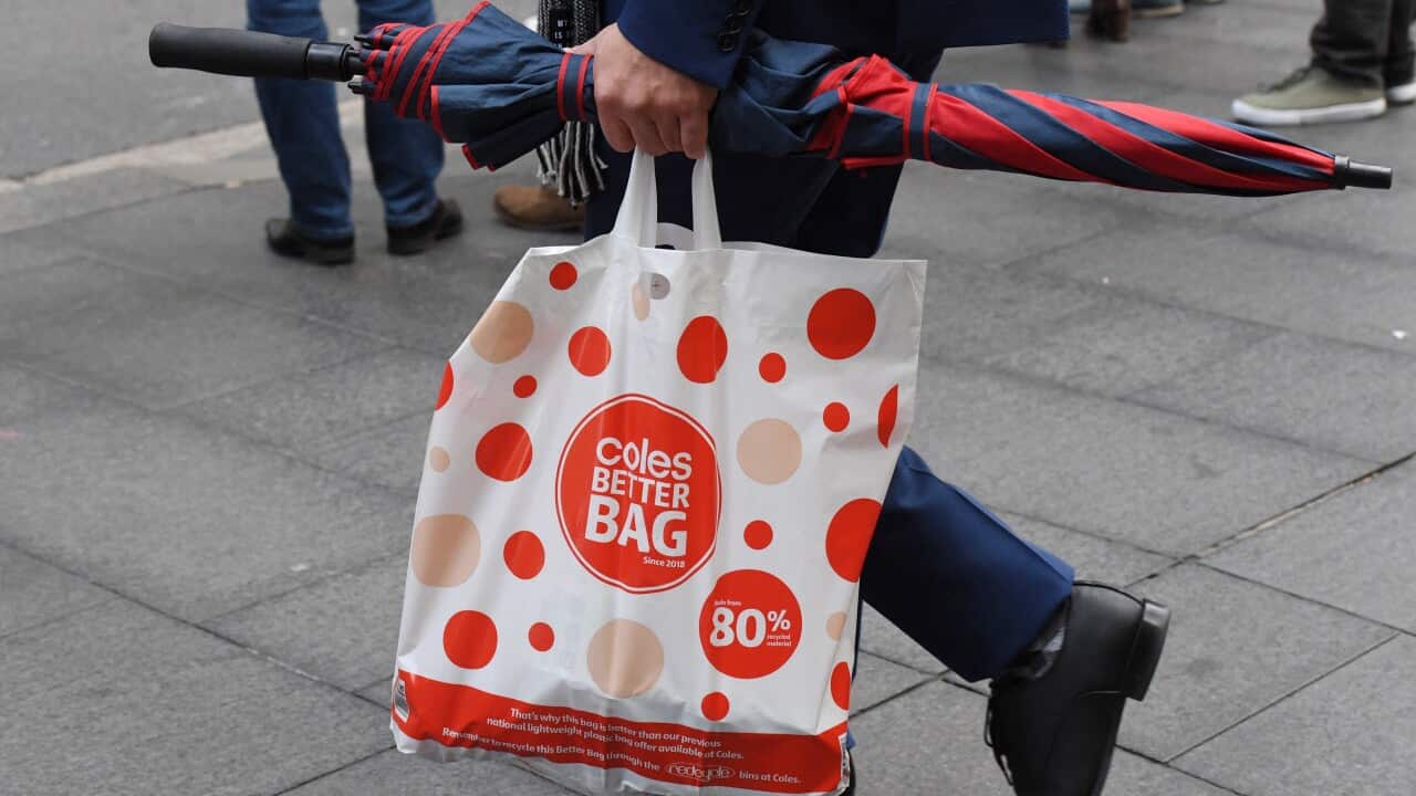 A shopper is seen carrying a reusable plastic bag at a Coles Sydney CBD store, Sydney, Monday, July 2, 2018.