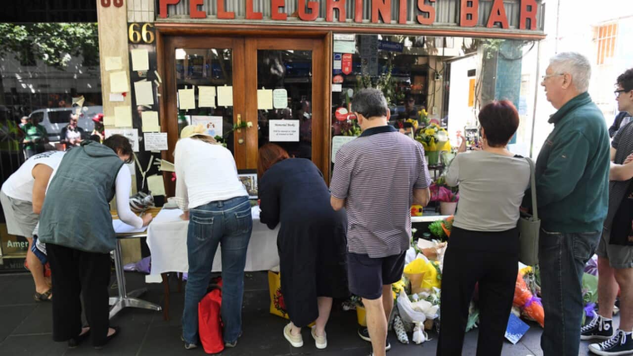 Mourners pay their respects to Sisto Malaspina, co-owner of Pellegrini's Espresso Bar, Bourke Street, Melbourne, Sunday, November 11, 2018. Sisto Malaspina was the victim of Friday's terror incident. (AAP Image/James Ross) NO ARCHIVING