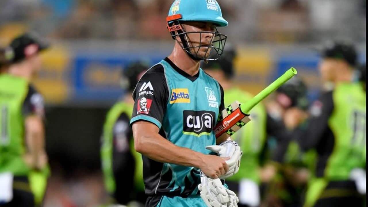 Chris Lynn of the Heat walks off the field after losing his wicket.