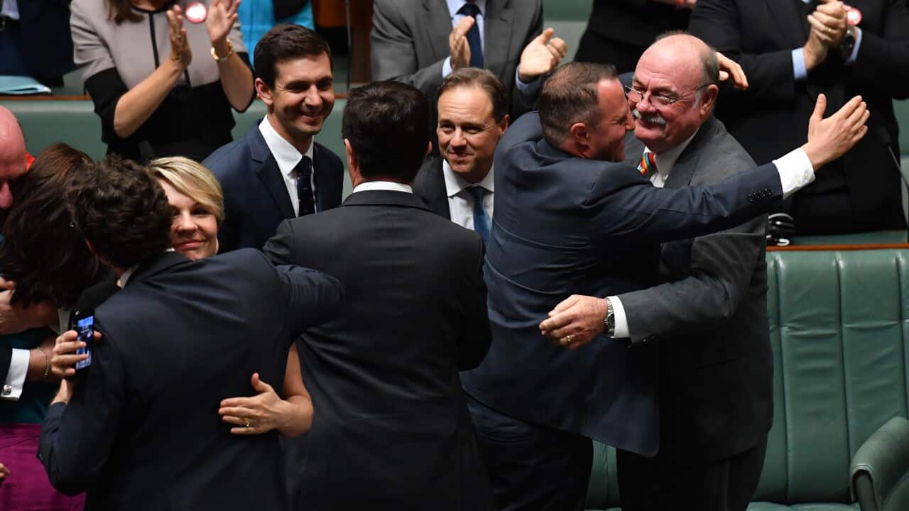Parlametarian celebrate the passing of the Marriage Amendment Bill in the House of Representatives at Parliament House in Canberra, Thursday, December 7, 2017. (AAP Image/Mick Tsikas) NO ARCHIVING