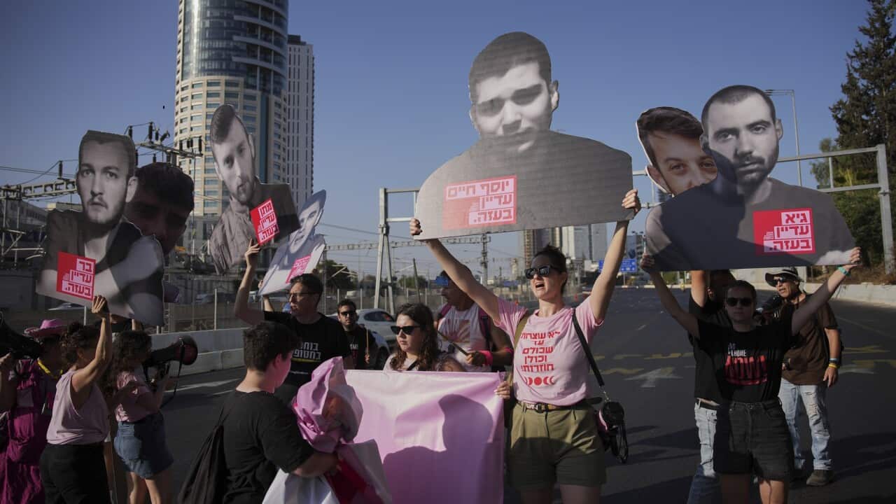 Protesters in Tel Aviv hold up signs calling for the release of hostages in Gaza