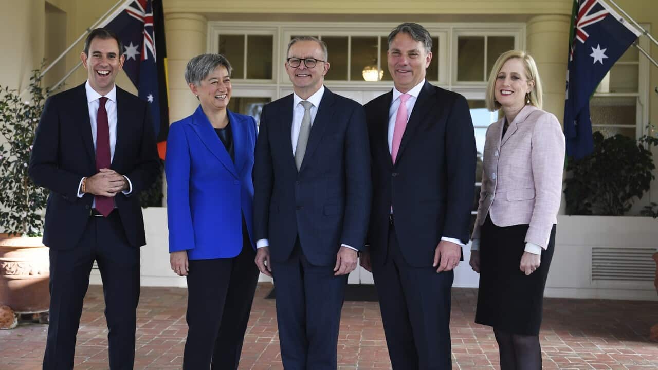 Australian Prime Minister Anthony Albanese poses for photographs with interim ministers Penny Wong, Jim Chalmers, Richard Marles and Katy Gallagher