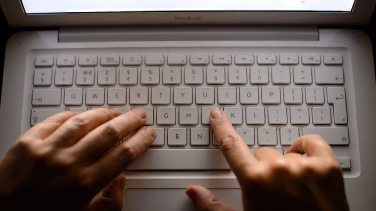 A person uses a laptop