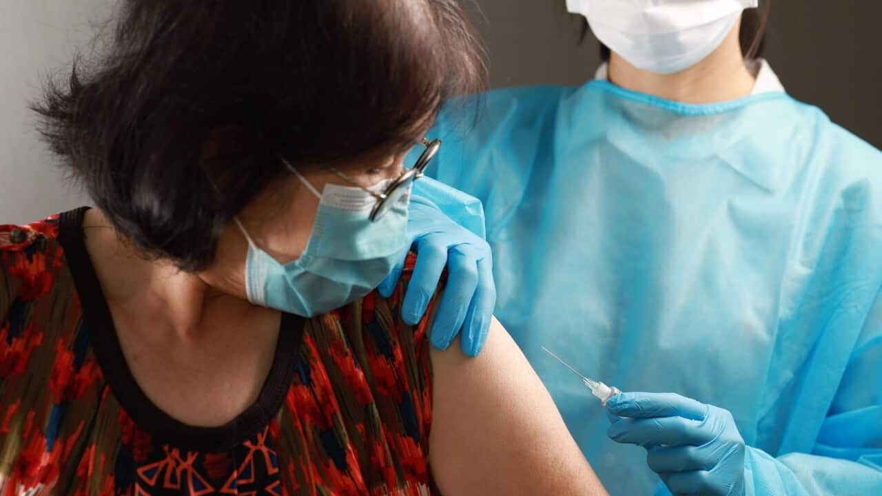 A woman is about to get a COVID-19 vaccination (Getty)
