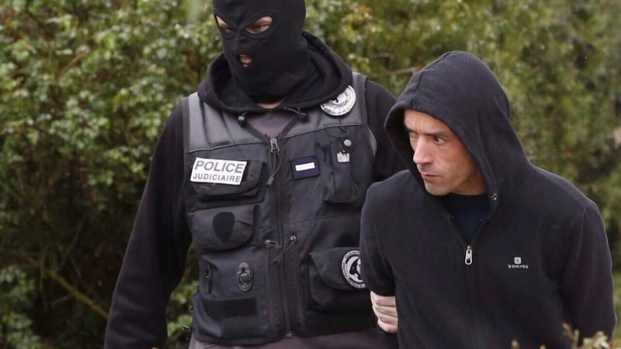 A French policeman escorts ETA commander Mikel Irastorza (R) after his arrest at the Serres district in Ascain, France, 05 November 2016.