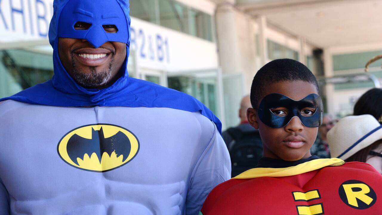 Erien Hodge and his son Adonis, 13, are dressed as Batman and Robin at the 45th annual San Diego Comic-Con, in San Diego California July 24, 2014. (AFP)