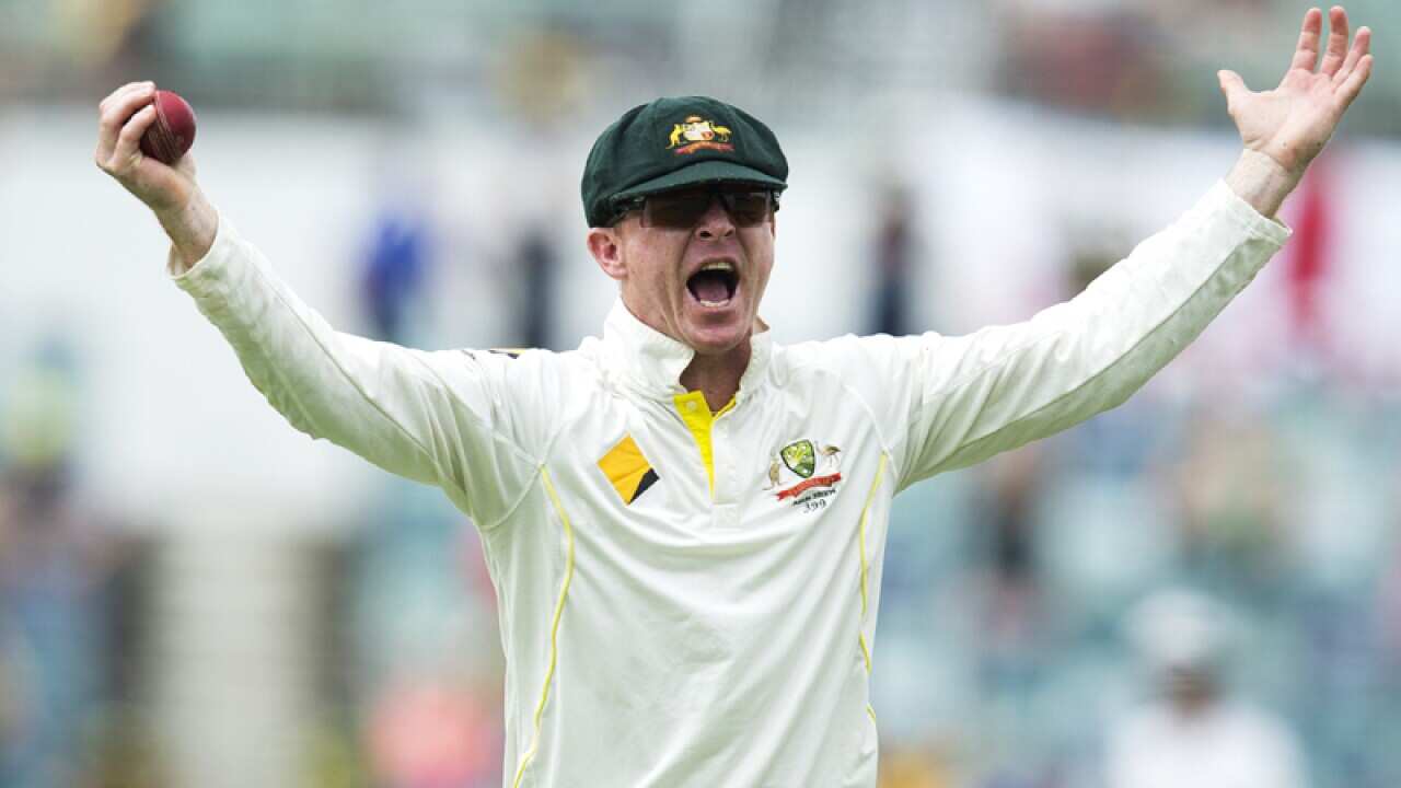 Batsman Chris Rogers reacts.