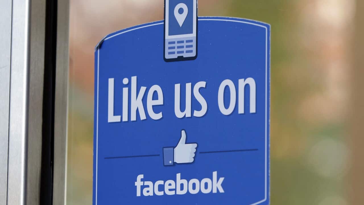 FILE - In this Dec. 13, 2011 file photo, a sign with Facebook's "Like" logo is posted at Facebook headquarters.