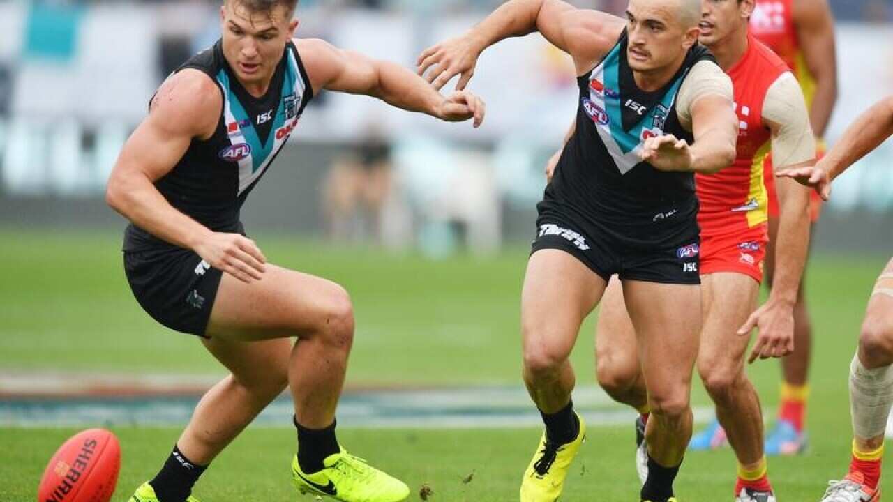 Ollie Wines and Sam Powell-Pepper of the Power contest the ball