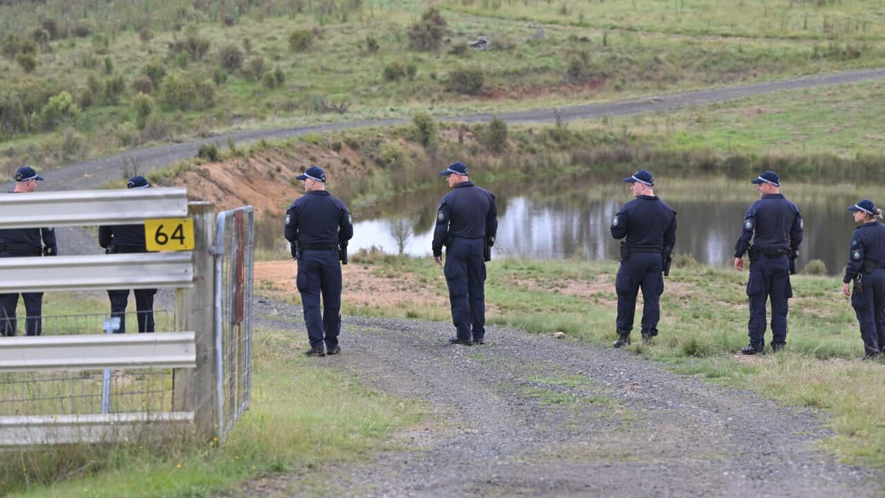 NSW Police line up to search a property