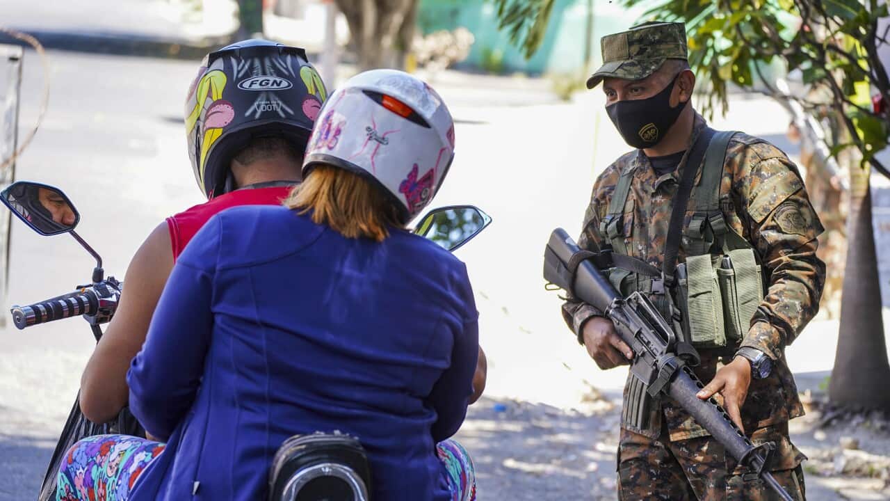 A soldier stops a motorcyclist at a checkpoint. Today, El Salvador registered it's highest number of homicides in recent history when 62 homicides linking to gangs were recorded. (Photo by Camilo Freedman / SOPA Images/Sipa USA)