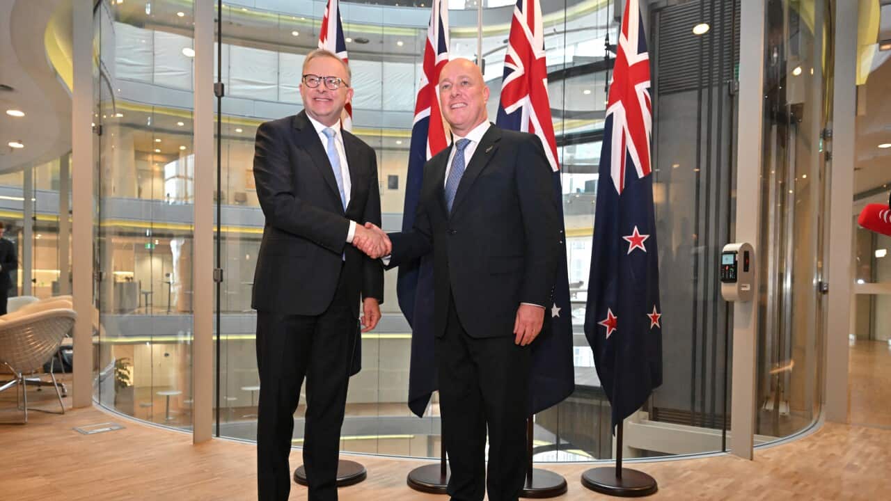 Two men in suits shaking hands