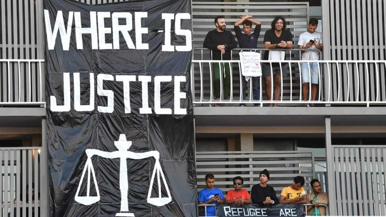 Asylum seekers are seen inside the Kangaroo Point Central Hotel in Brisbane.