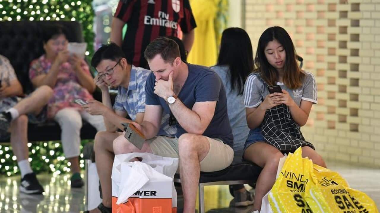 Shoppers are seen at Pitt Street Mall in Sydney