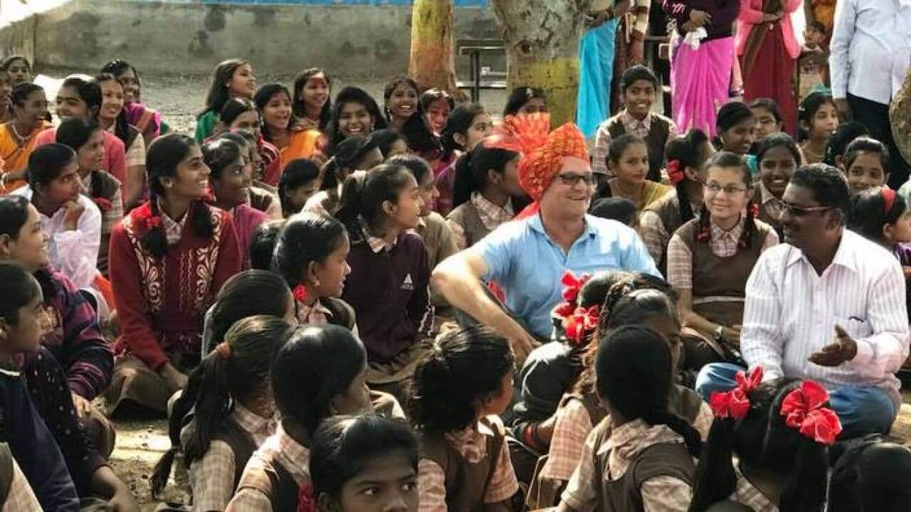 Mark Balla wih students