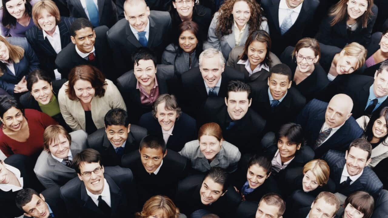 Large Group of Business People Standing and Looking up at Camera