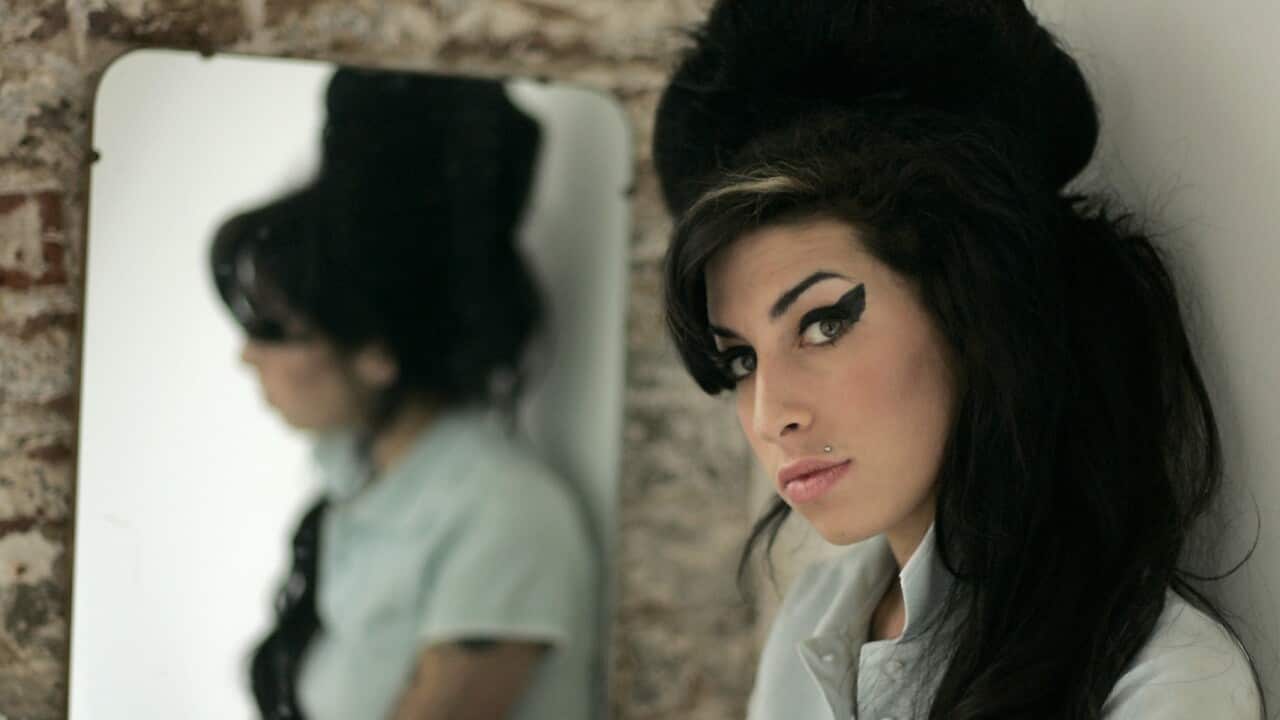 A studio portrait of Amy Winehouse