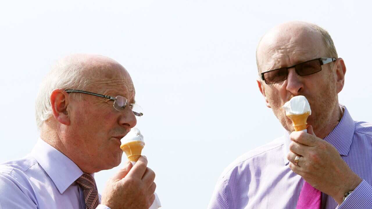 Racegoers enjoy an ice cream