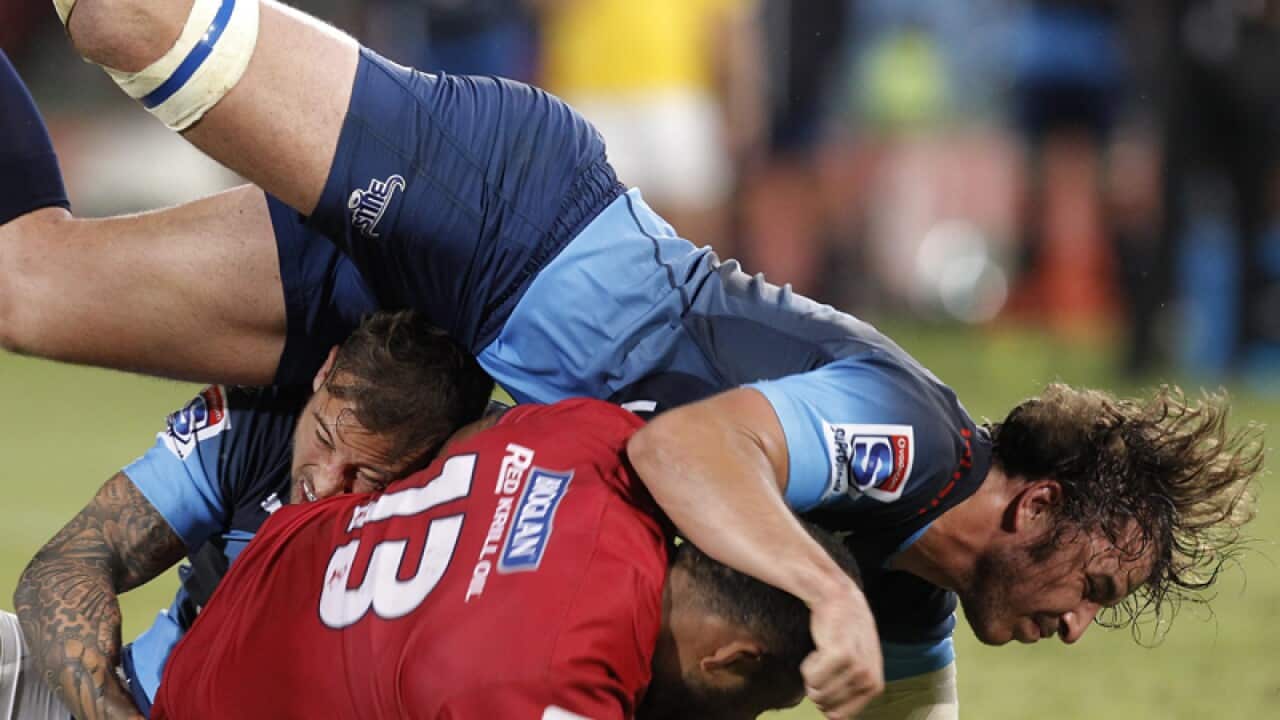 The Bulls Burger Odendaal (top) Tackles The Reds Samu Kerevi (bottom)