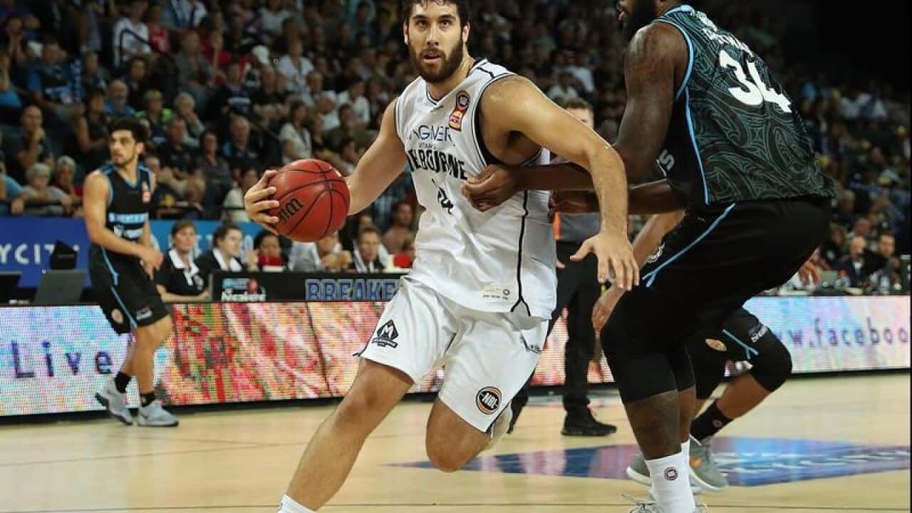 Tohi Smith Milner of United is challenged by Rakeem Christmas.