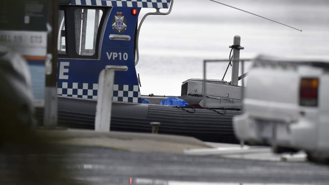 A police boat believed to be carrying the bodies of a plane crash