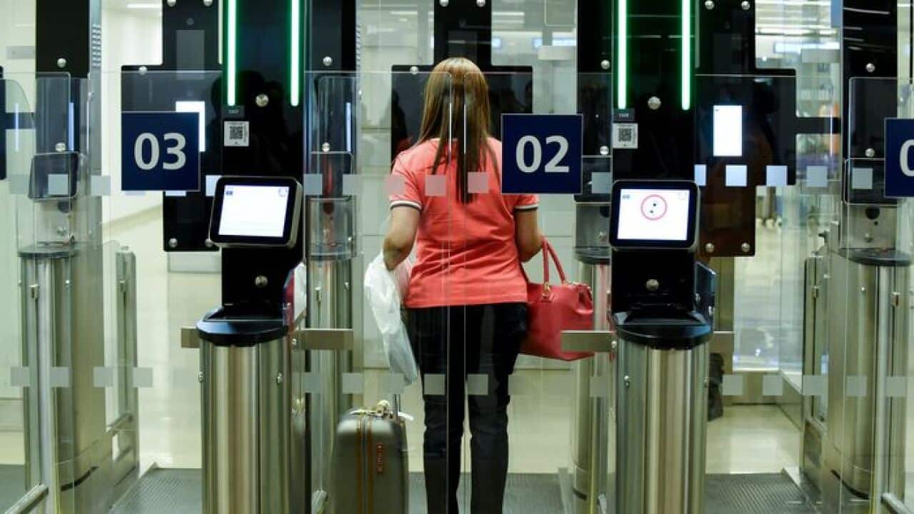 A passenger uses "Parafe", an automated border passport control at Orly airport, near Paris on July 6, 2018. (Photo by ERIC PIERMONT / AFP) (Photo credit should read ERIC PIERMONT/AFP/Getty Images)