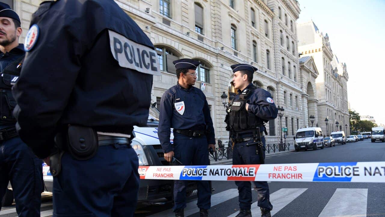 Police and military personnel block the bridge near Paris Police headquarters after four officers were killed in a knife attack on October 3, 2019 in Paris