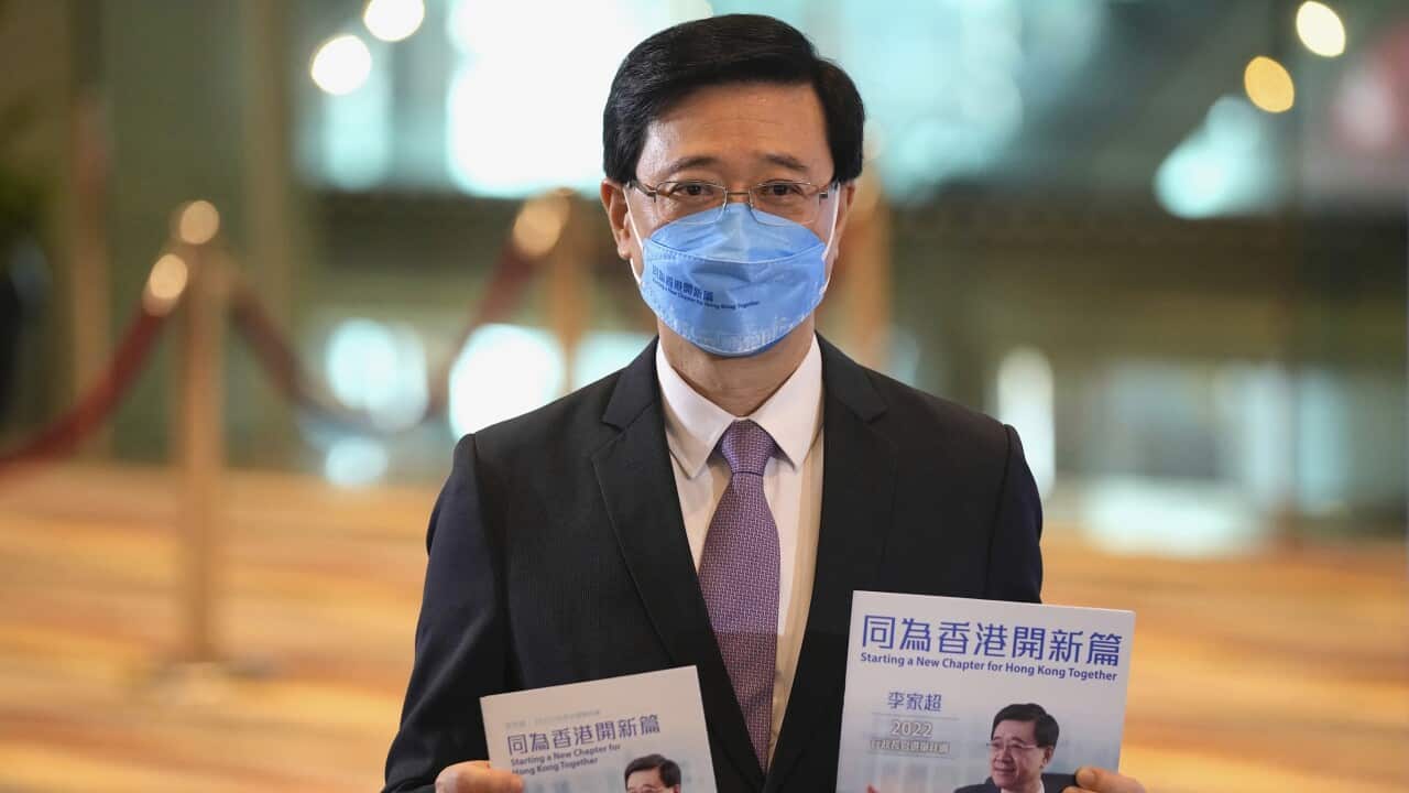 John Lee, former No. 2 official in Hong Kong, and the only candidate for the city's top job, poses during a press conference after announcing his manifesto during the 2022 chief executive electoral campaign in Hong Kong, Friday, April 29, 2022.