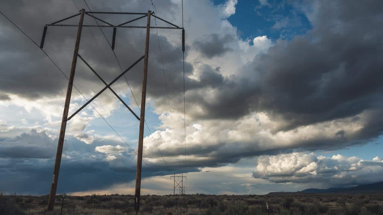 Electric cable lines under a cloudy day