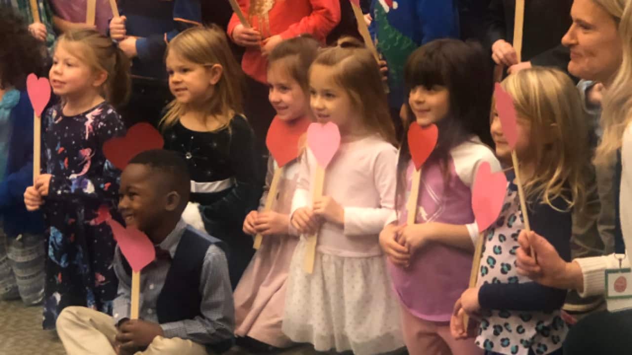 Foster child's kindergarten class shows up to support him at adoption