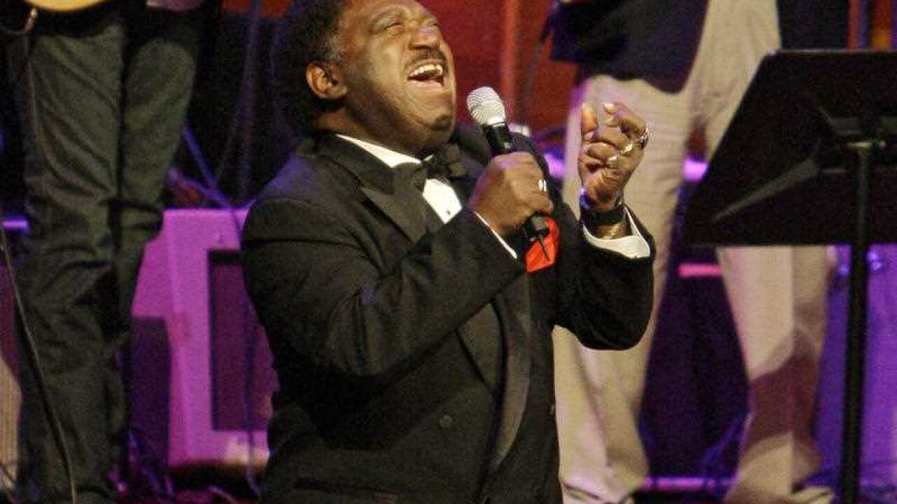 Percy Sledge kneels as he performs "When a Man Loves a Woman" along with the Muscle Shoals Rhythm Section at the Musicians Hall of Fame awards show in Nashville (AP)