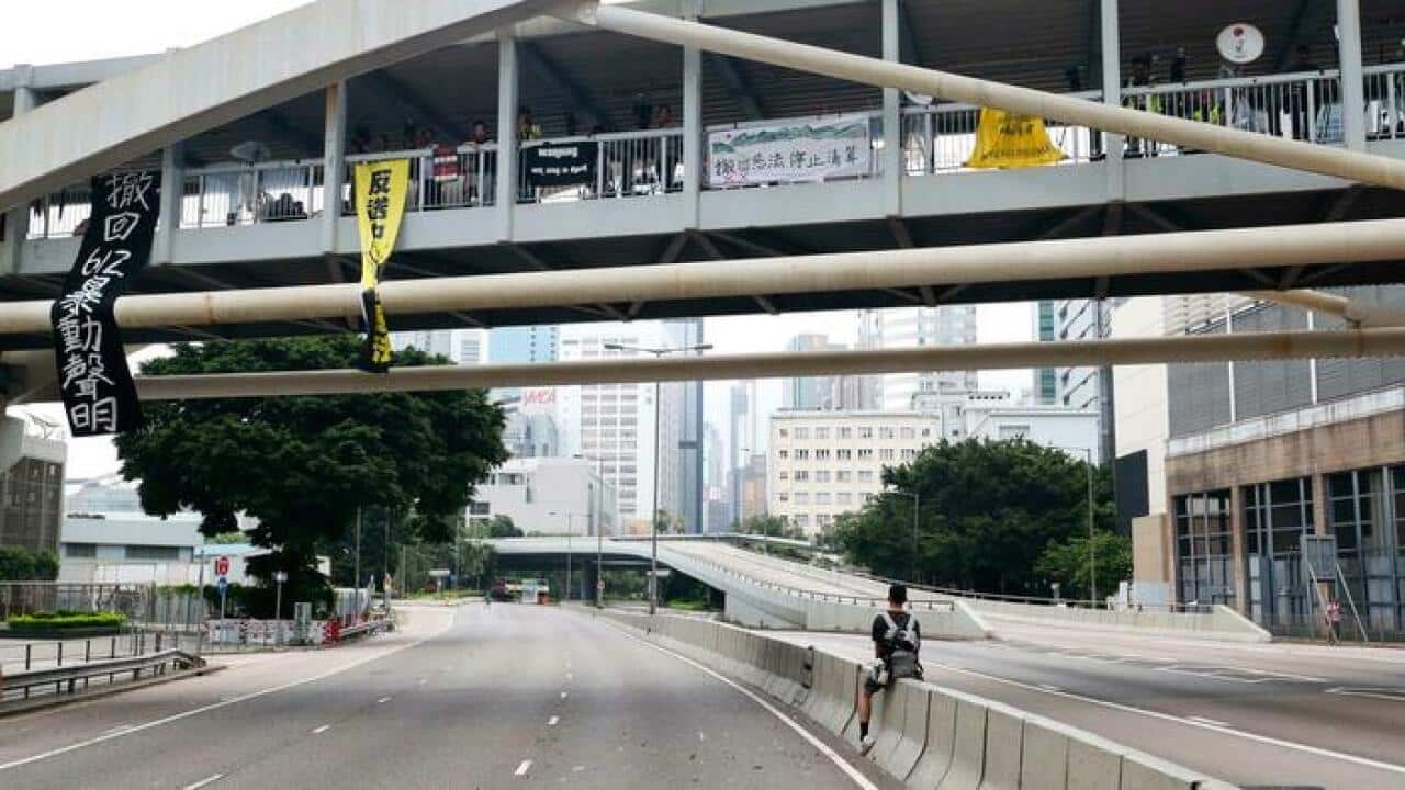 Photo shows empty roads in Hong Kong after demonstrators were cleared following a rally in which they demanded the resignation of pro-Beijing leader Carrie Lam