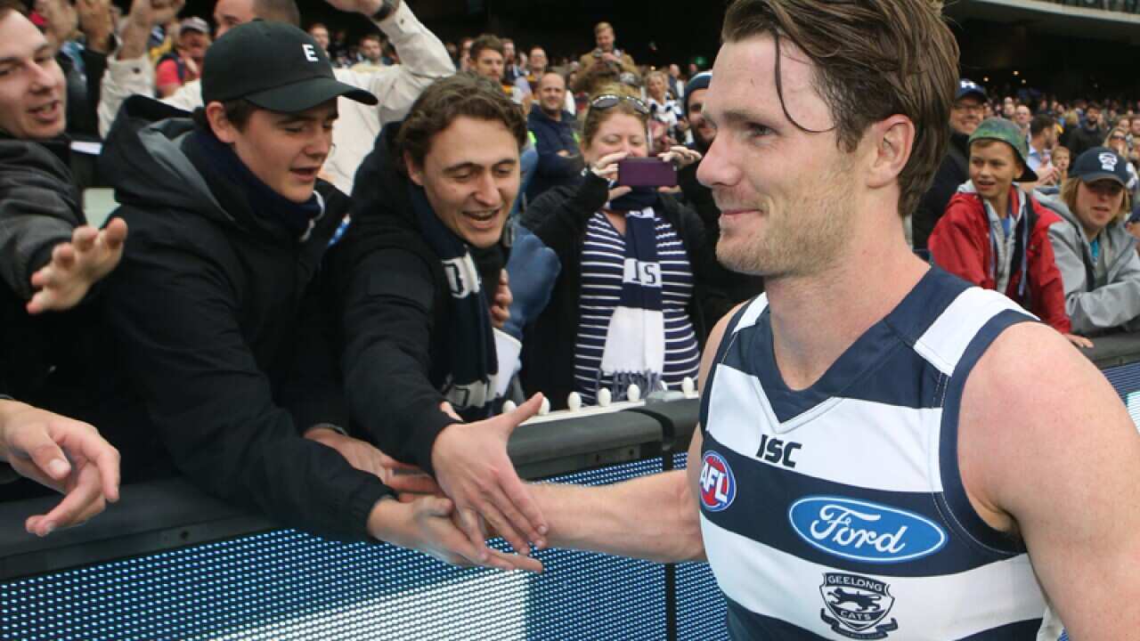 Patrick Dangerfield celebrates with fans