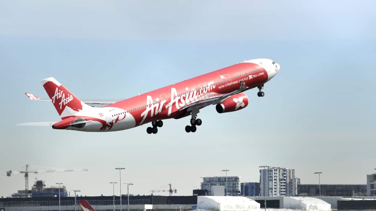 Air Asia aircraft seen at Sydney International Airport, Sydney, Friday, Aug. 12, 2016. 