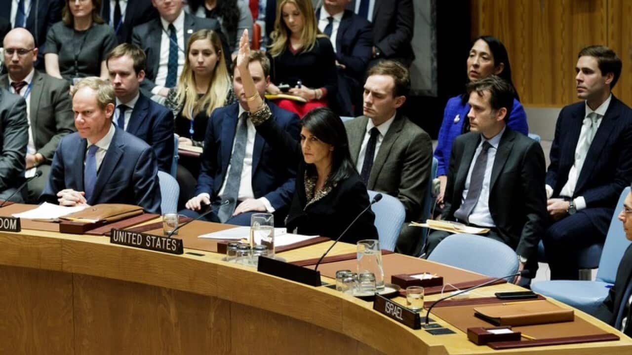 Nikki Haley vetoes a draft UN resolution that calls on, among other things, for counties to not establish diplomatic missions in Jerusalem.