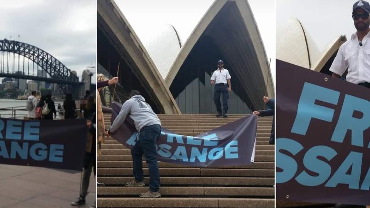 Julian Assange supporters are quickly moved on from the steps of the Sydney Opera House.