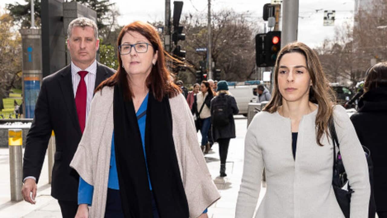 Former chair of NAB's superannuation trustee NULIS Nicole Smith (c) after giving evidence at the Royal Commission