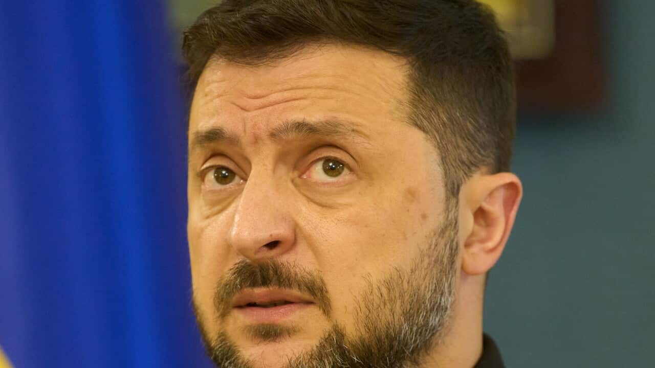 A man speaks at a press conference.