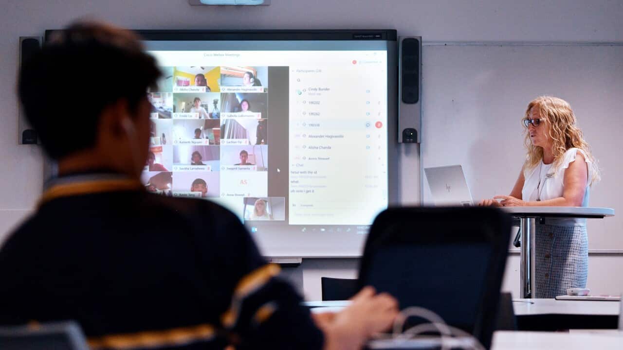Teacher Cindy Bunder is seen demonstrating a virtual classroom at Glenunga High School in Adelaide, Friday, April 3, 2020. The school has introduced virtual classrooms. (AAP Image/David Mariuz) NO ARCHIVING