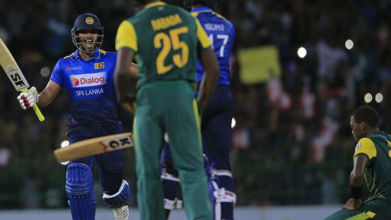Dinesh Chandimal celebrates Sri Lanka win.