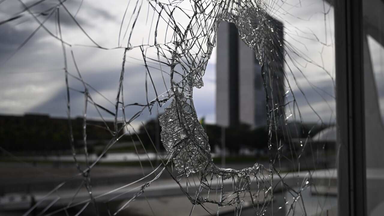 A broke window at Planalto Palace, in Brasilia, Brazil (Getty)