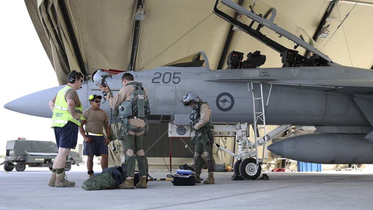 Royal Australian Air Force aircrew after a mission in the Middle East