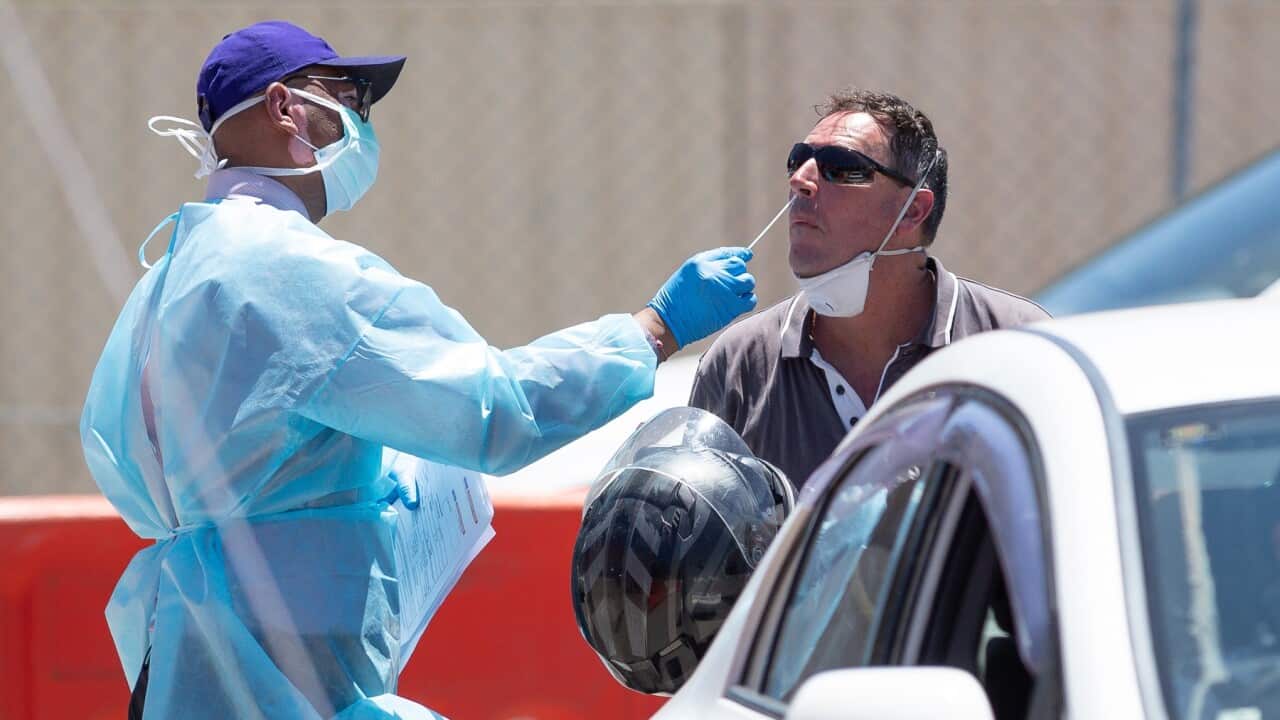 A member of the public has a sample taken at a covid testing site in Perth