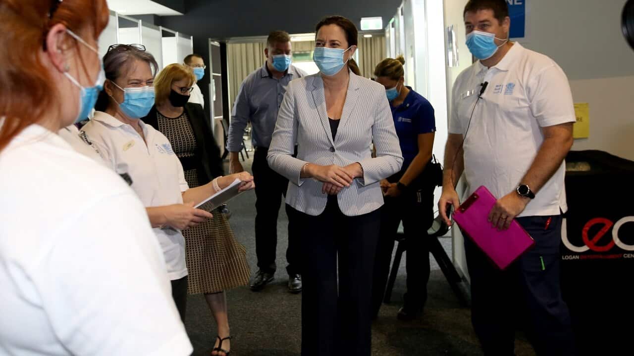Queensland Premier Annastacia Palaszczuk speaks to staff at Logan Vaccination Hub, south of Brisbane