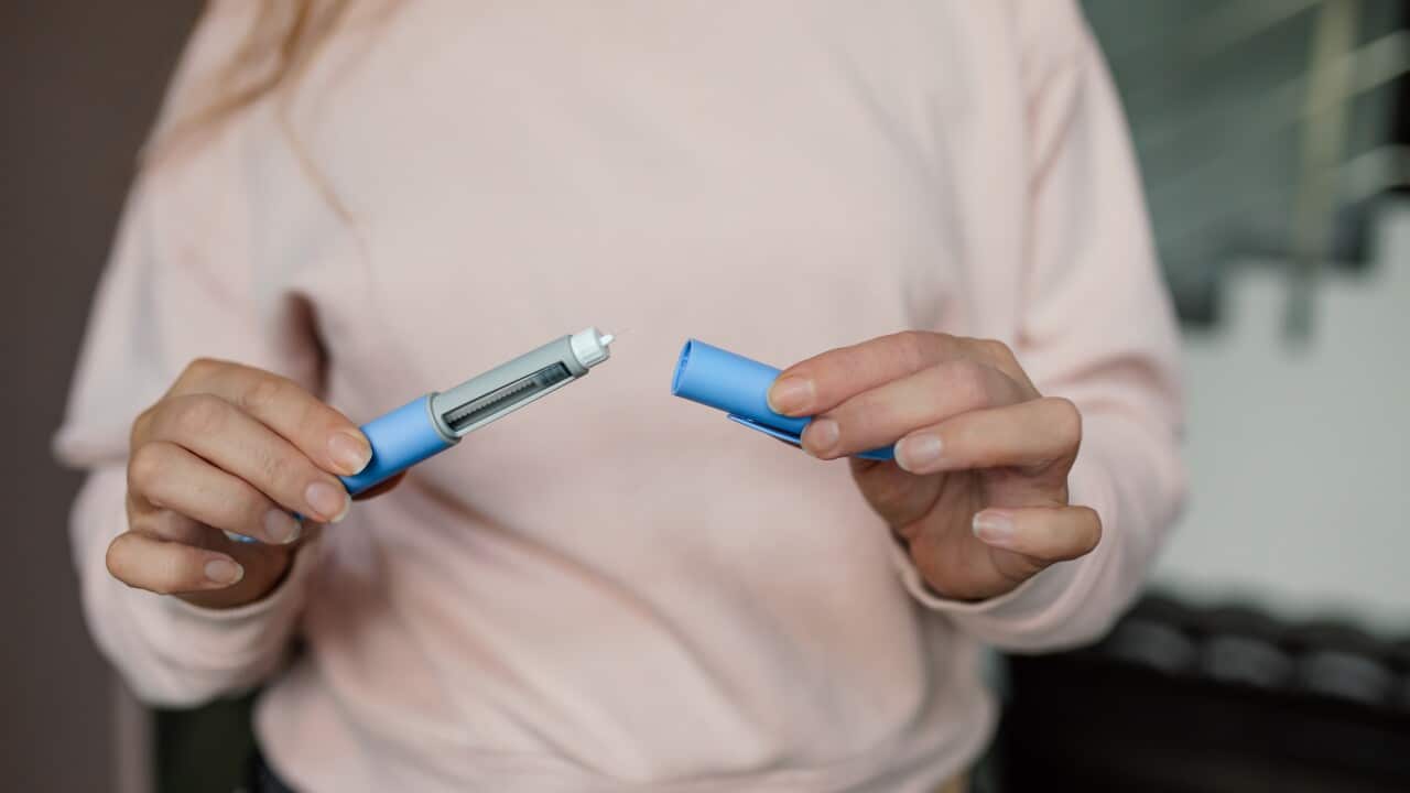 Hands Readying Semaglutide Pen for Subcutaneous Injection Therapy