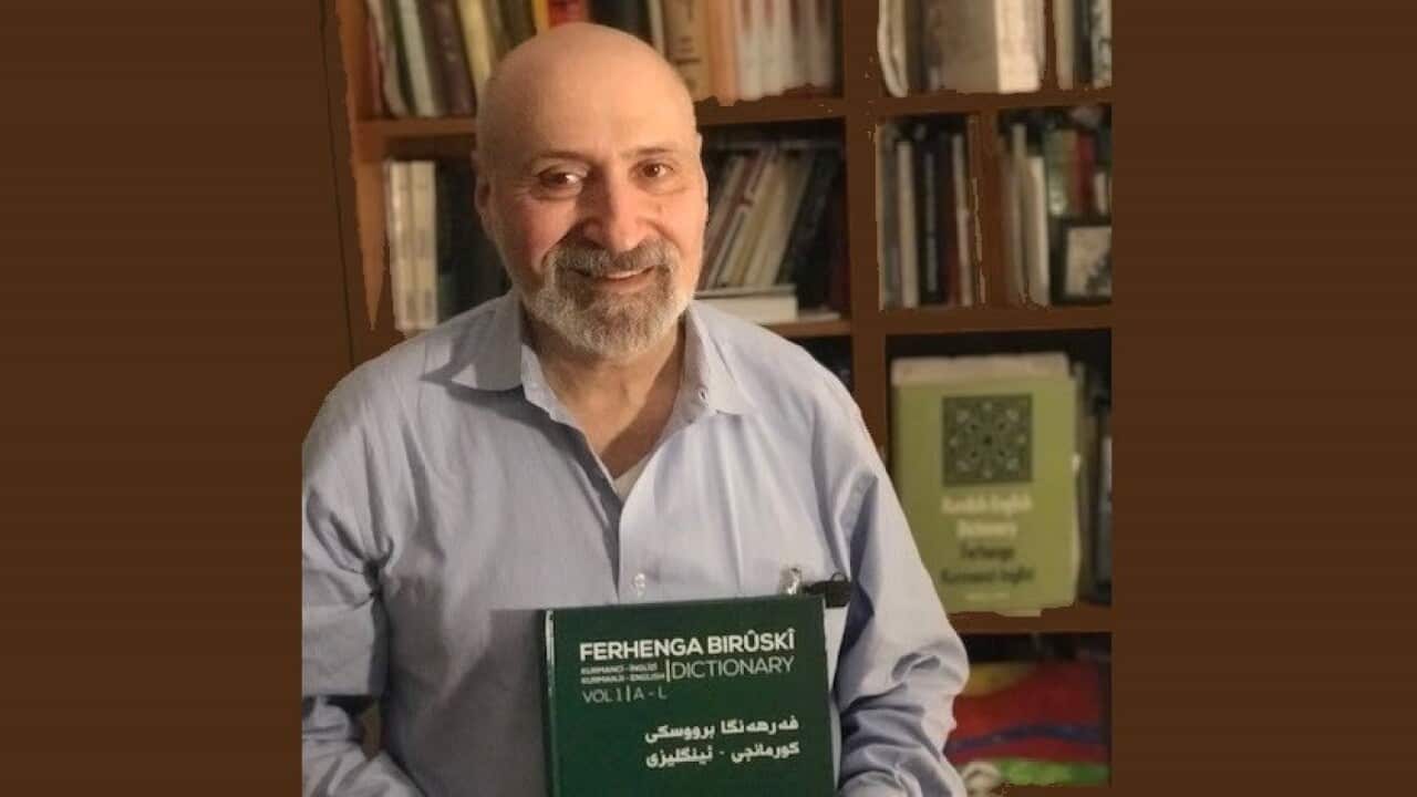 Michael Chyet holding his new dictionary