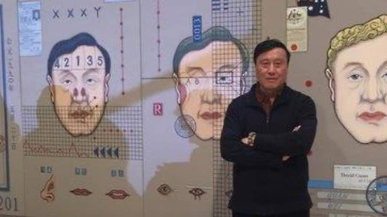 Finalist Wei Guan with his work Plastic surgery (Michelle Chen SBS)