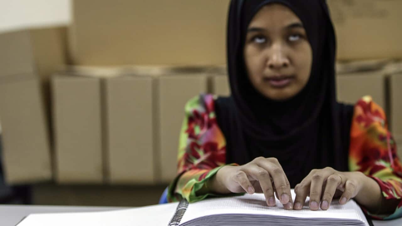 Siti Haida Hamidan, 30, blind Malaysian recite the Koran in Braille